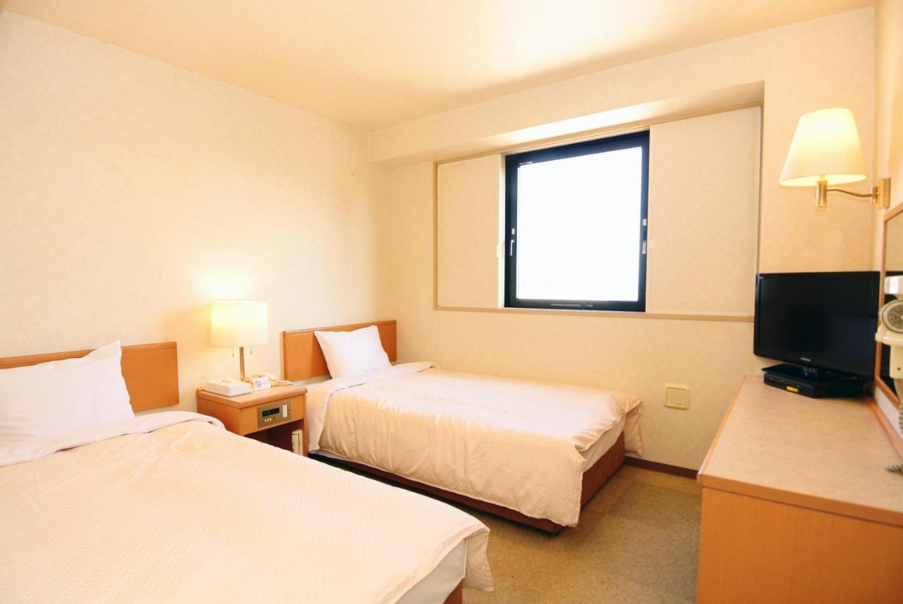 Business Hotel Kg Ойта Екстер'єр фото